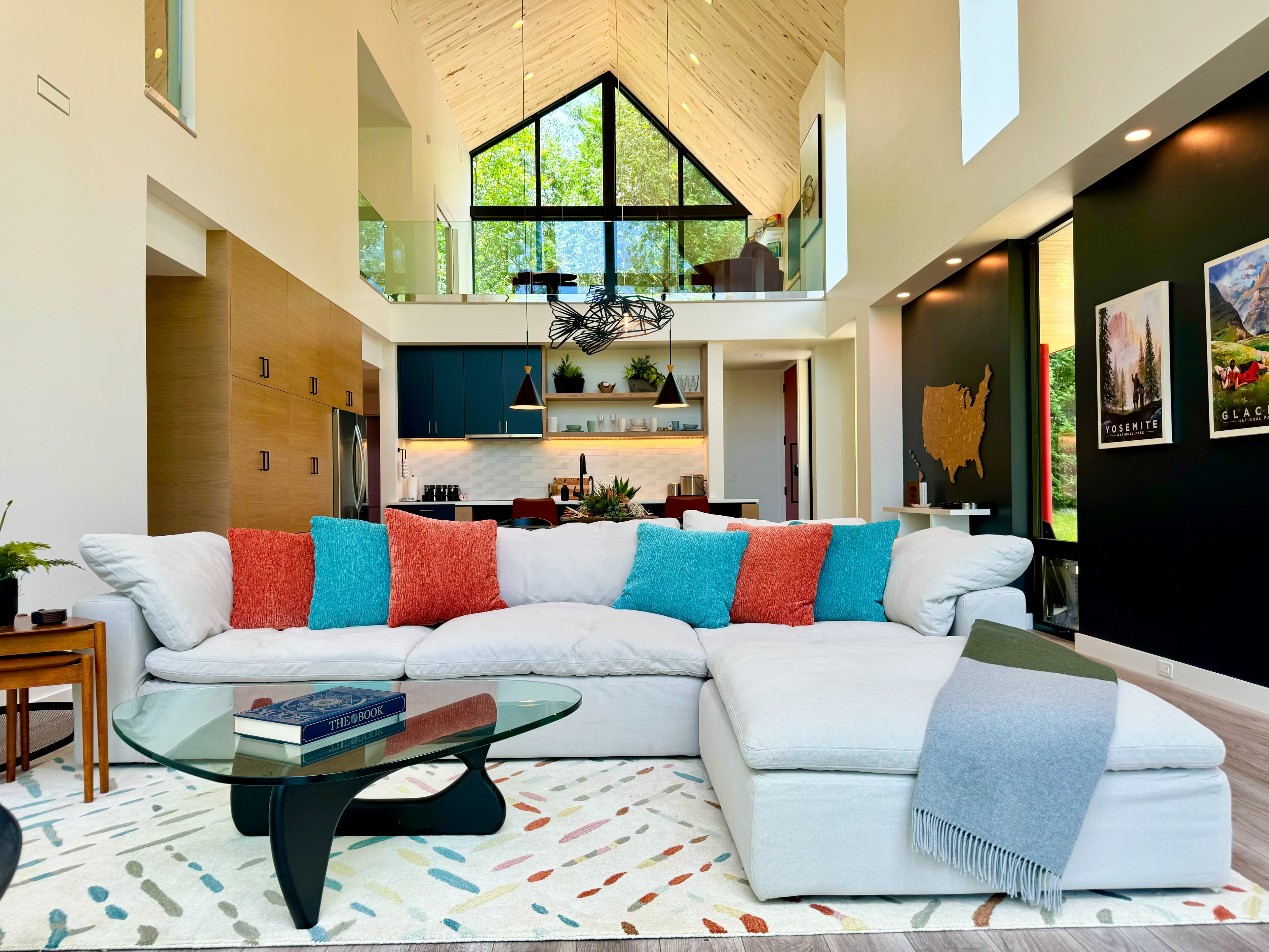 Great room with floor-to-ceiling windows and river view