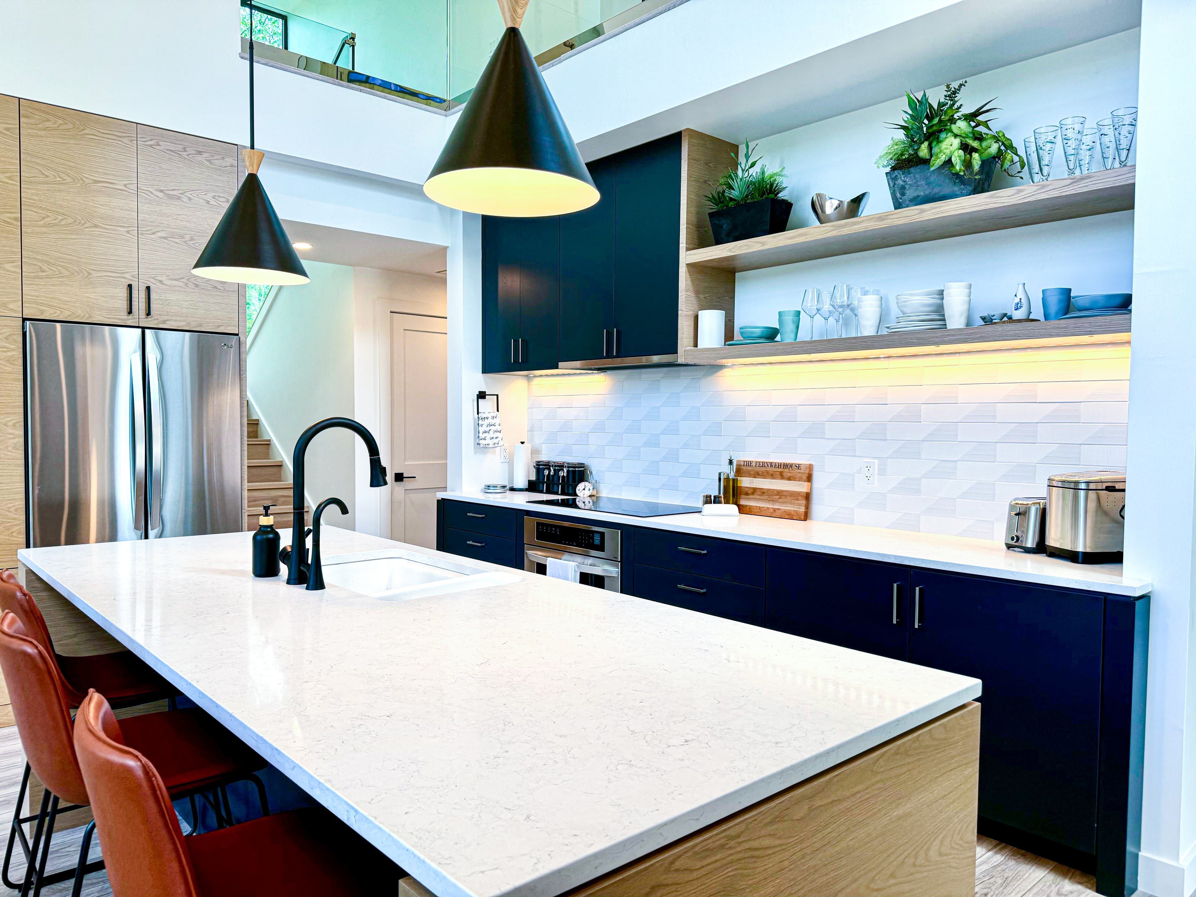 Kitchen — custom cabinets, induction cooktop, stocked for real cooking